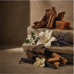 Lily, honey, vanilla and tobacco arranged on stone